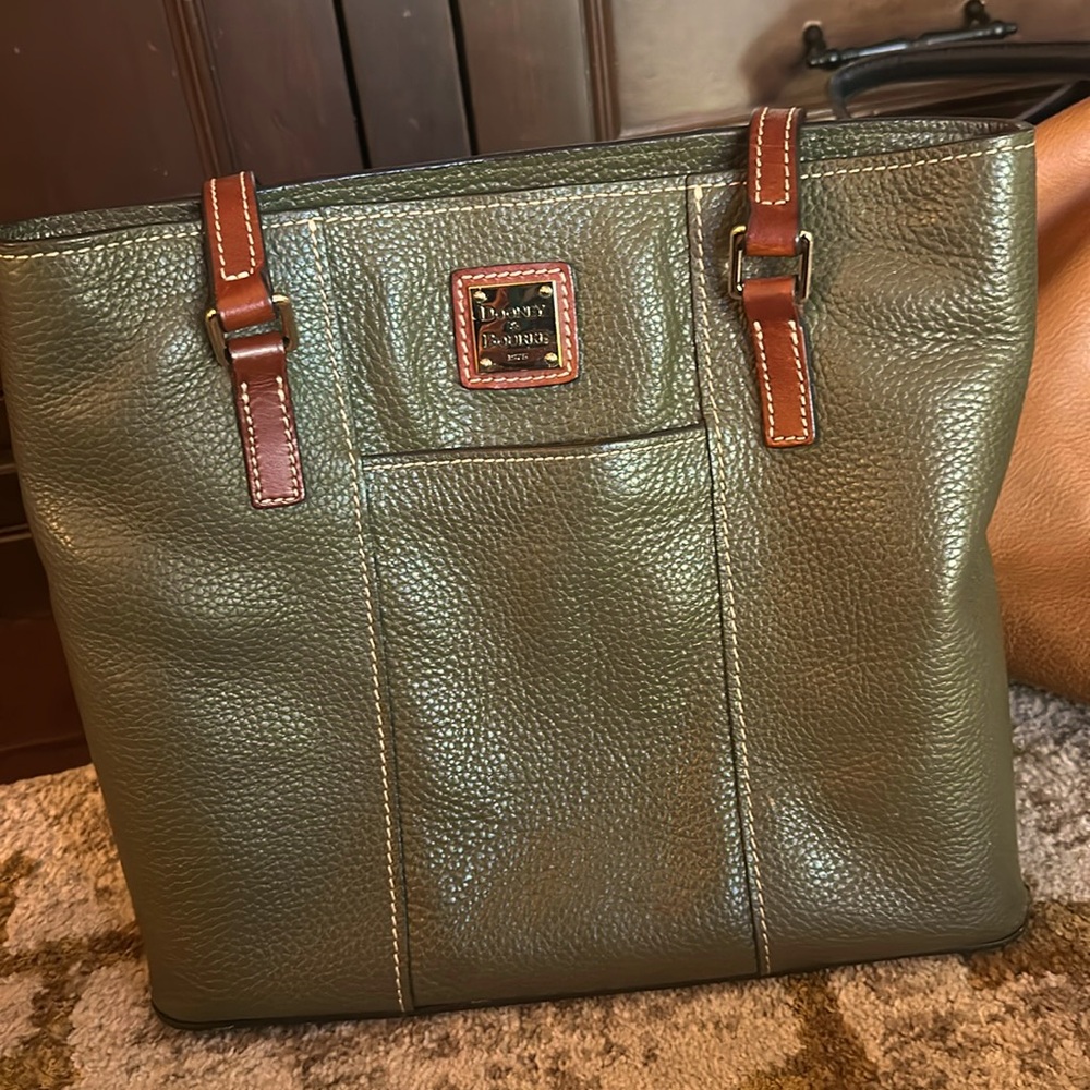 Dooney and Burke leather bag with red interior.